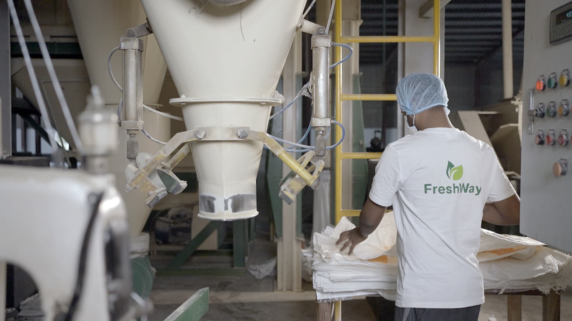 FreshWay staff bagging feed at the mill